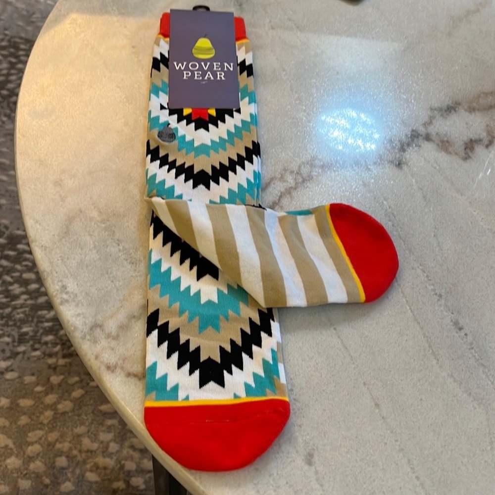 New Socks. Aztec designs. Colors are beige black white turquoise tan red yellow.
